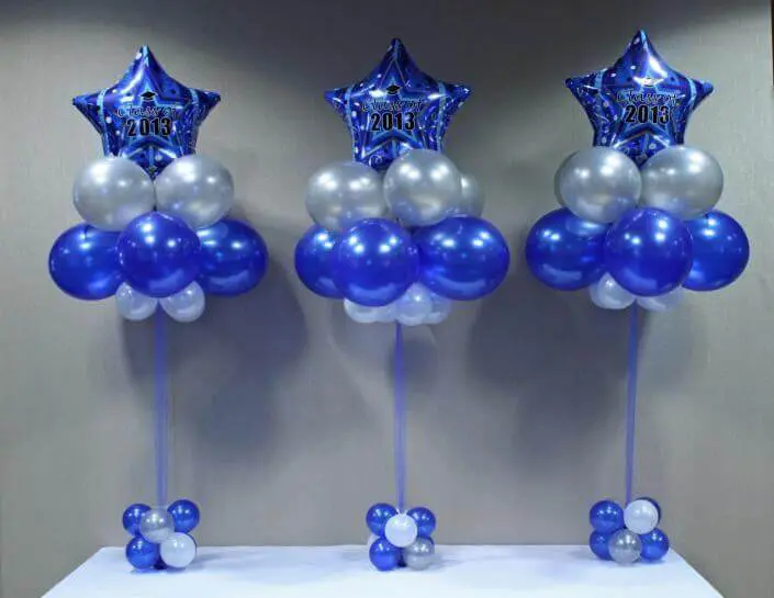 Column of navy, silver, and light blue latex balloons with navy star balloons for decoration delivered by Balloons Lane in Brooklyn