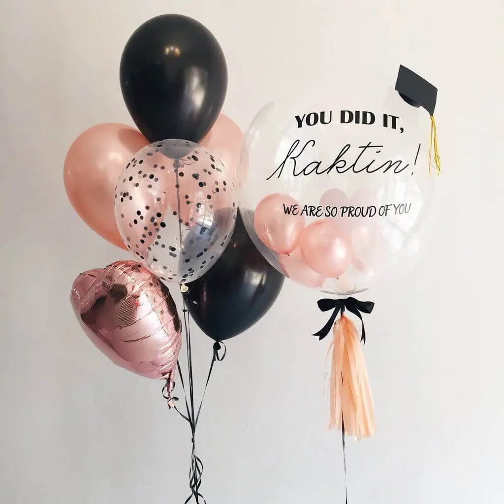 Black, Rose Gold, and Confetti Balloons for the graduation party.