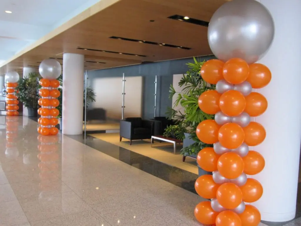 Column of orange and silver latex balloons for anniversary celebration by Balloons Lane in NJ