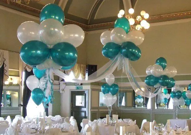 An elegant arch made of Emerald Green, White, and Silver latex balloons, perfect for adding a touch of sophistication to an event party in Brooklyn, delivered by Balloons Lane balloon delivery.