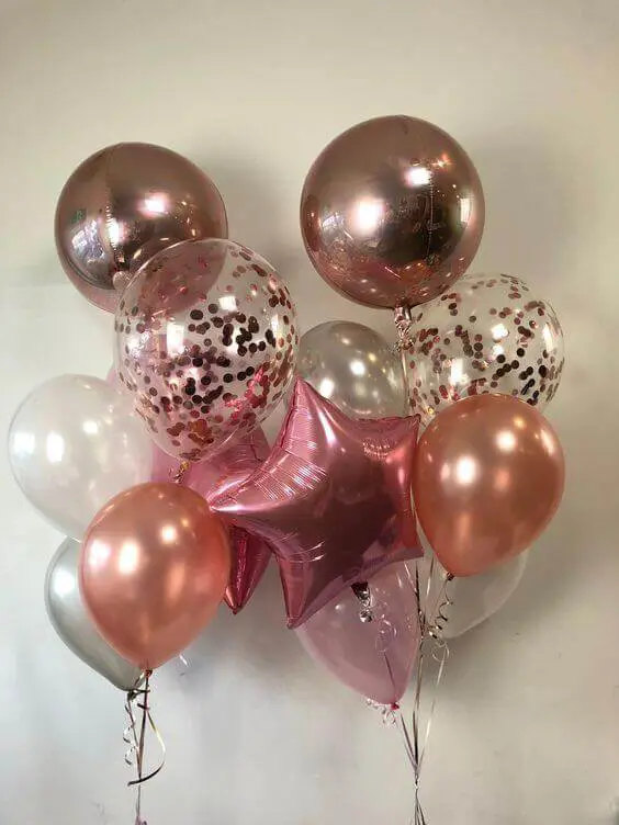 Balloons Lane uses rose gold, white, chrome silver, pink, and mauve balloons, latex pink Mylar confetti balloons, and personalized confetti for anniversary parties.