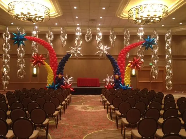 An impressive arch made of Fireworks balloons and Mylar Big Silver Chain Links, perfect for adding a touch of celebration and excitement to any occasion.
