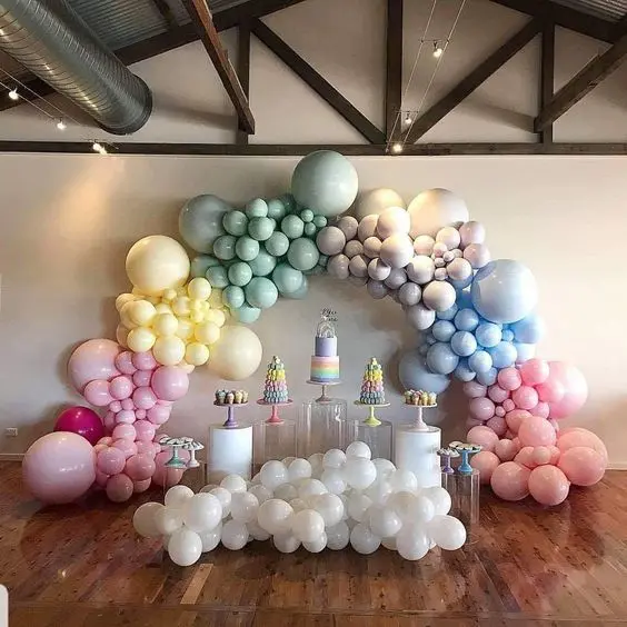 Pastel organic balloons garland arch with Ivory Silk, White, Pink, Winter green, Blush and Sparkling Burgundy balloons by Balloons Lane Balloon delivery in NYC for an event.