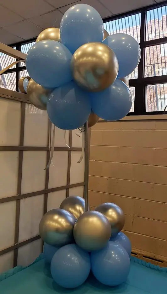 Beautiful silver and blue balloon columns for your baby's christening.