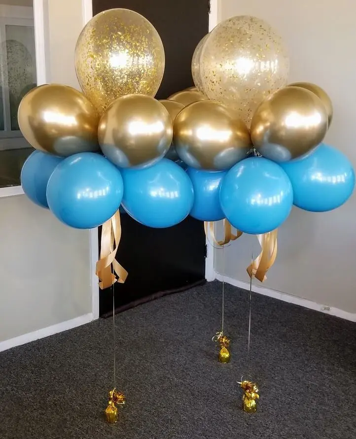 BBlue and gold latex balloons with gold confetti balloon centerpieces and LED balloon centerpieces.