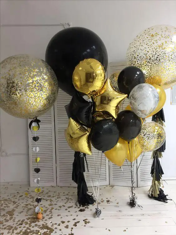 black, white, and gold confetti balloons along with big round gold Mylar star balloons for birthday, graduation or any special occasion