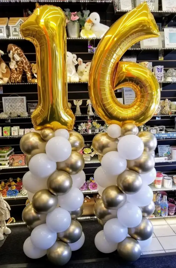 Sweet 16 balloon column in gold, white, and silver by Balloons Lane in NYC.