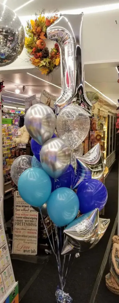 balloon arch in Caribbean Blue, Navy, and Silver colors, with number 1 balloon in silver, perfect for a first birthday balloon theme.