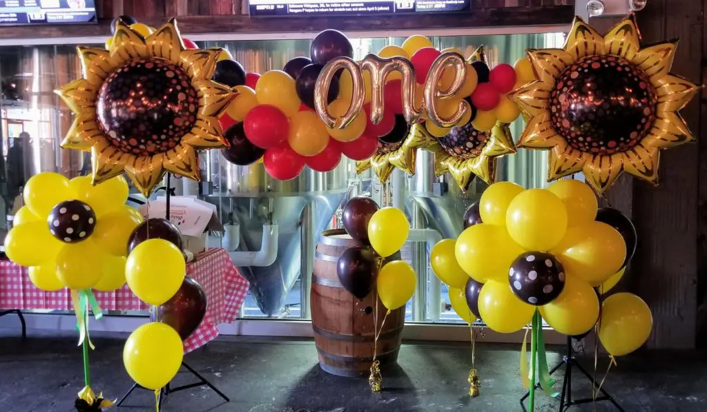 Yellow, Chocolate Brown, White, Mocha Brown, and Chrome Rose Gold balloons, along with Letter balloons spelling out "one" in Chrome Gold, perfect for first birthday balloon arch.