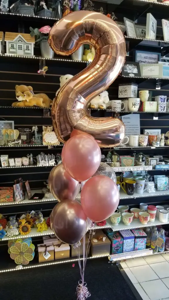 Rose Gold, Pink, and Chrome Rose Gold Balloon column with Number Balloons 2 in Gold, Brooklyn