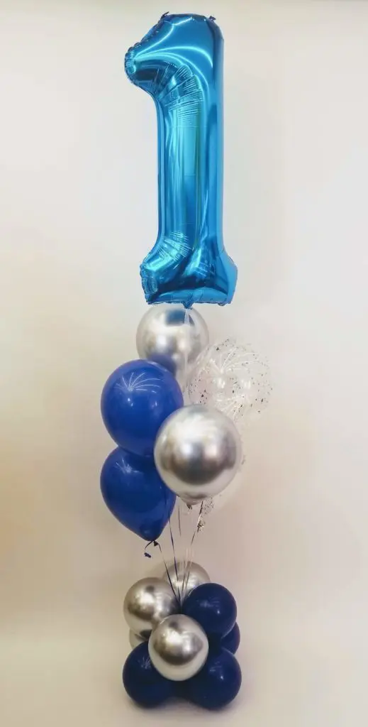 A navy blue, chrome silver, and purple balloon column with number balloons in blue