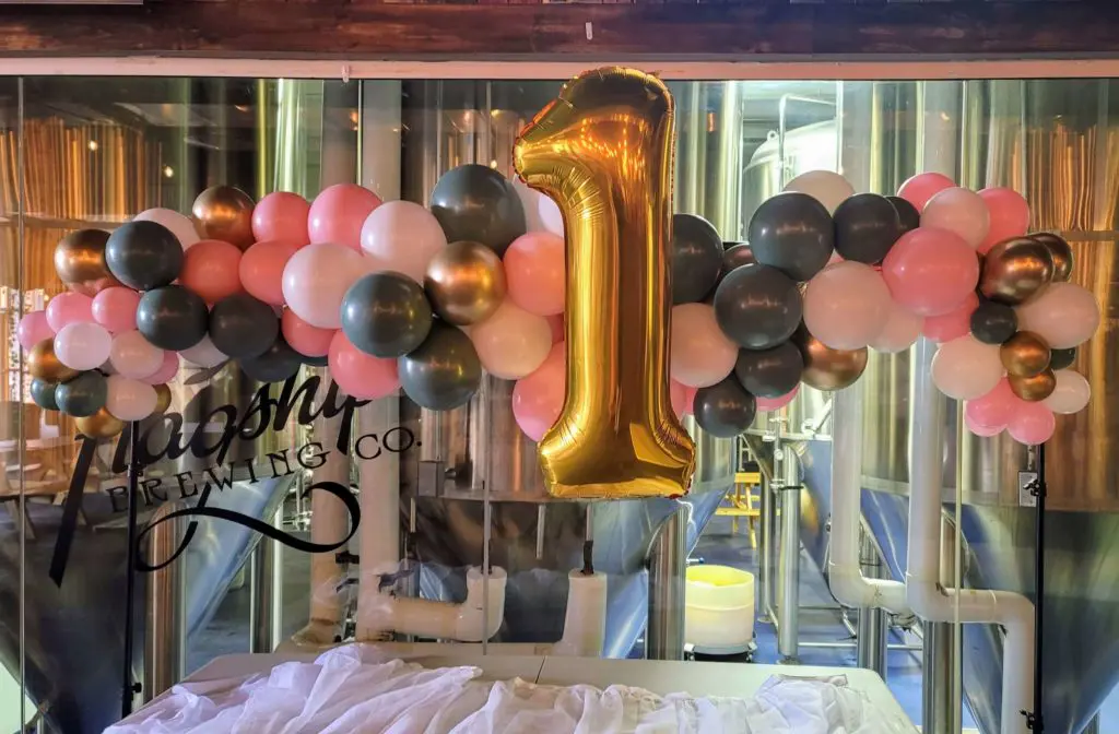 Pink Silver Gray Peach Lavender and Gold Balloon Arch is a Stunning Decoration for Your Little One's First Birthday Celebration